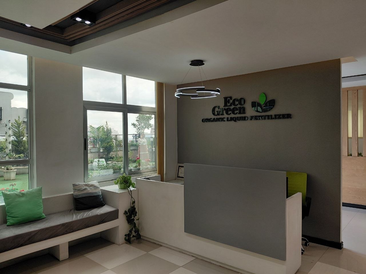 Eco Green head-office reception with the logo wall