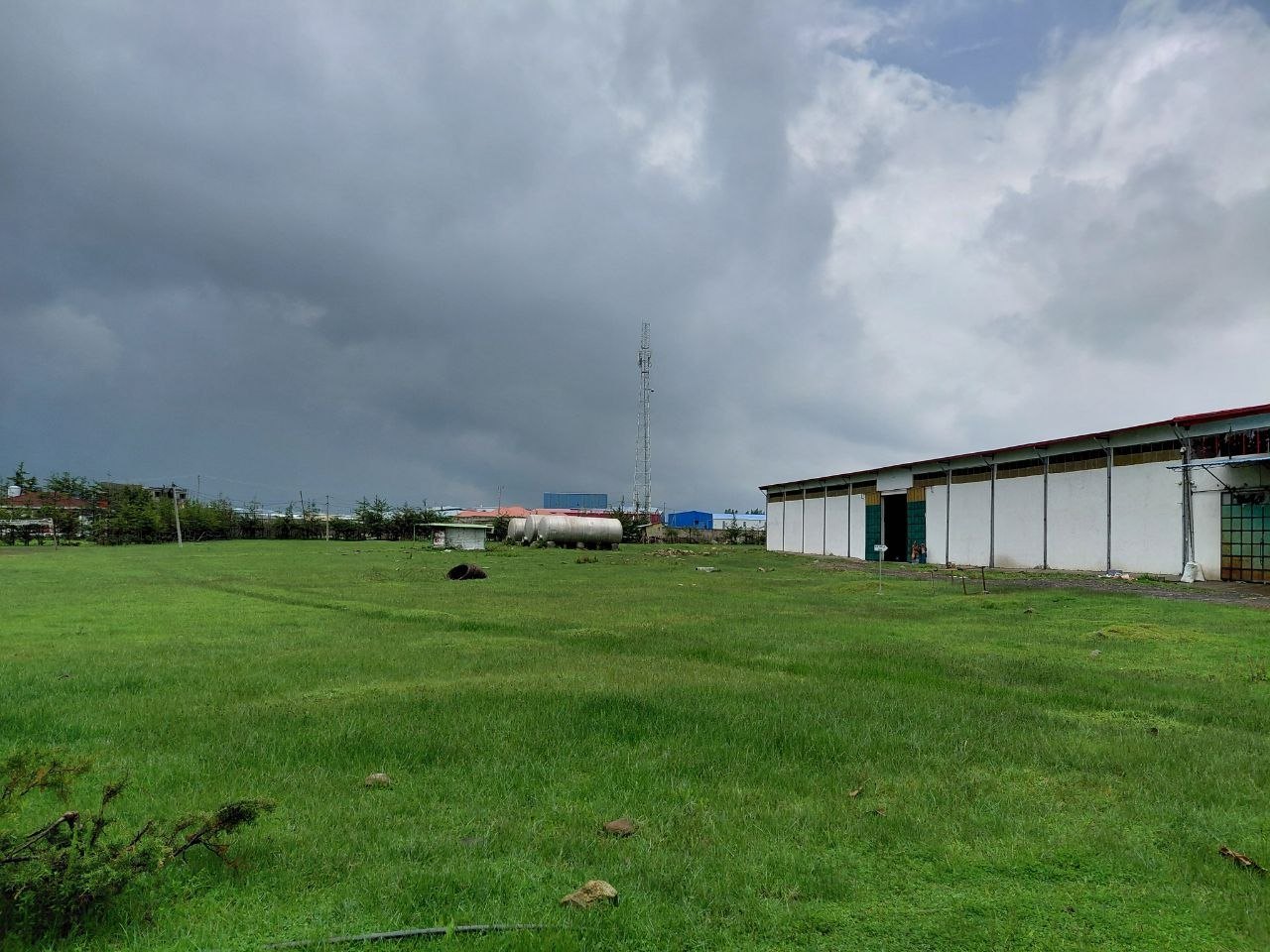 Eco Green warehouse across open green field