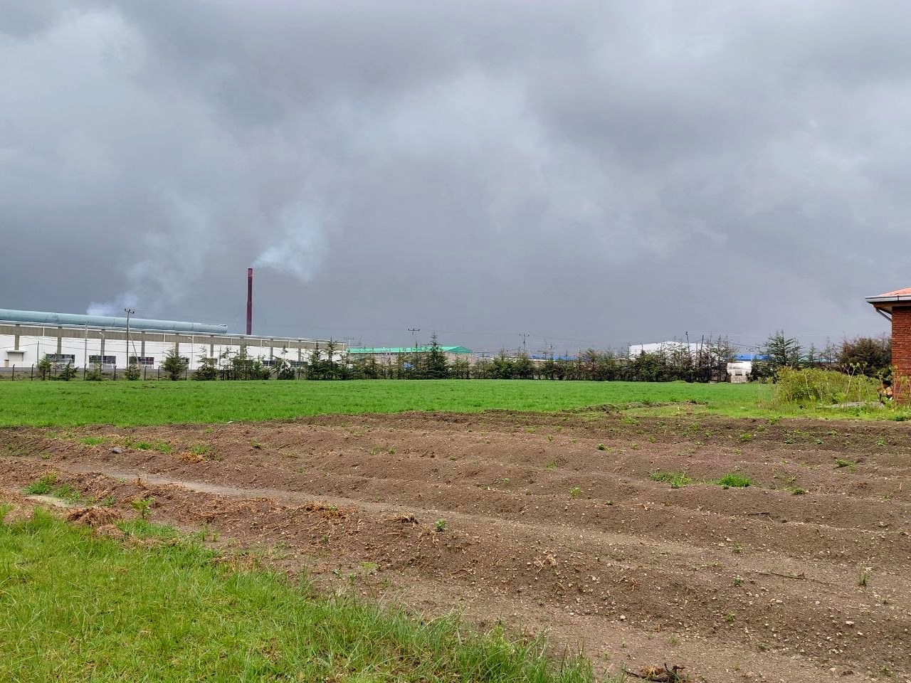 Facility and fields representing broader agricultural development